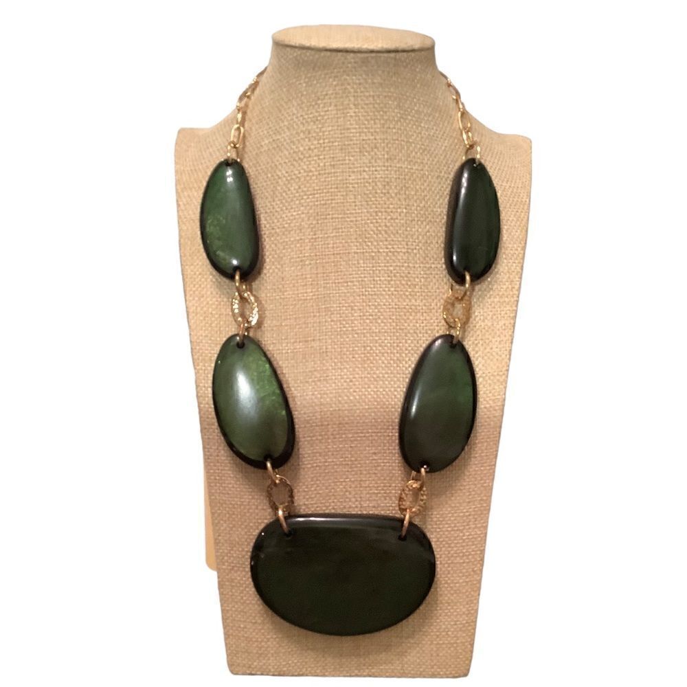 Gold tone necklace with oblong green stones. NWOT